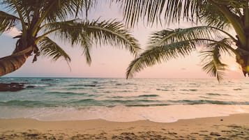 On the beach, sun-loungers, beach towels