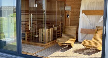 Vacation home Oskar on the lake with private beach for 4 adults, fireplace, boat and sauna