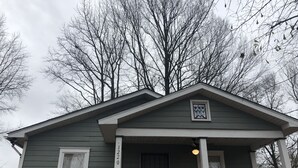 A single-story house with a front porch, a small window, and a door. - 1220 Hartford Avenue <br> Previous 4 star owner , Airbnb<br>Happy New Year to All (Atlanta)