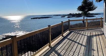 Sunrise Cottage. Relaxing waterfront deck on the rocky shore of Bailey Island.