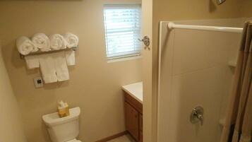 Bathtub, hair dryer, towels, soap