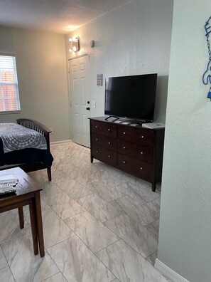 1 bedroom, desk, iron/ironing board, travel crib