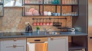 Fridge, stovetop, dishwasher, coffee/tea maker