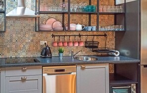 Fridge, stovetop, dishwasher, coffee/tea maker