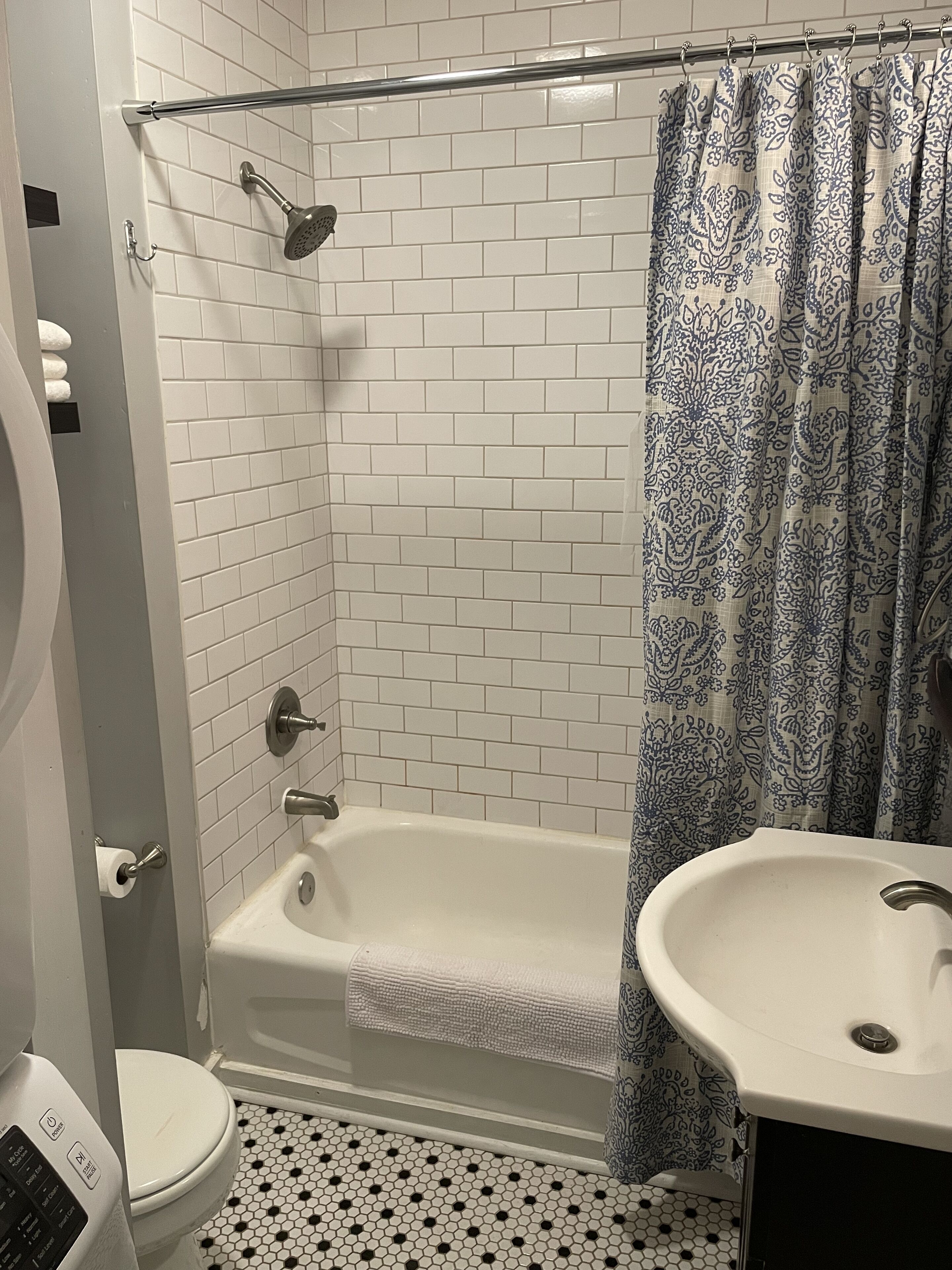 Combined shower/bathtub, hair dryer, towels, soap