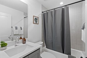 Combined shower/bathtub, hair dryer, towels, soap