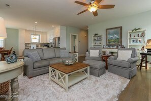 Cozy living space with a sofa, dining area, and kitchenette.