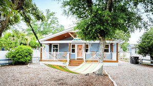 A house with a porch, a hammock, and a sign reading 'INKWELL 101'. - The Inkwell ~ An Oak Island Gem (Oak Island)
