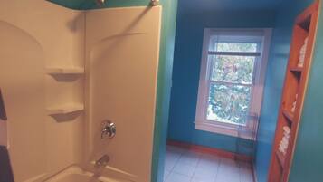 Combined shower/tub, hair dryer, towels, soap
