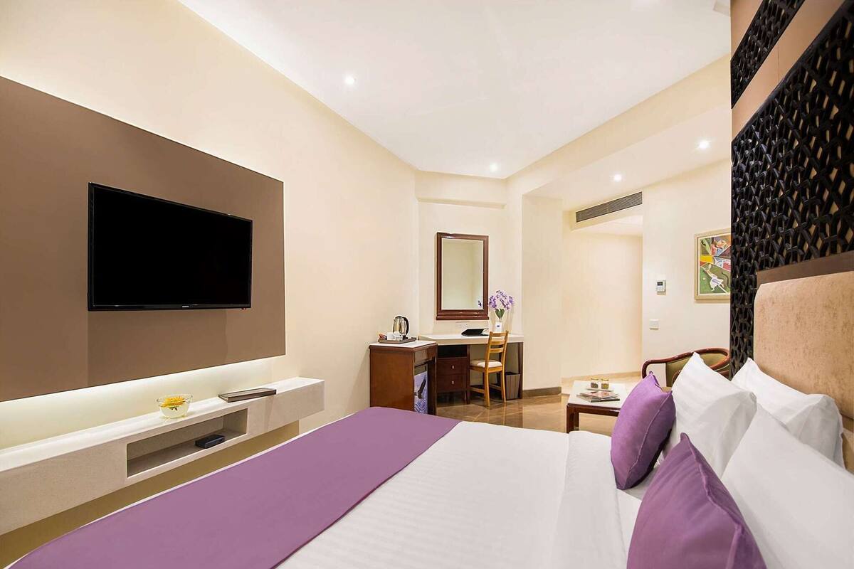 エグゼクティブ ルーム ダブルベッド 1 台 | 高級寝具、ミニバー、デスク、遮光カーテン