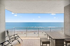 A balcony with a view of the beach and ocean. - #702 Sanibel - Oceanfront Condo Panoramic Views (Daytona Beach Shores)