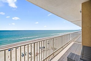 A balcony with a view of the beach and ocean. - #702 Sanibel - Oceanfront Condo Panoramic Views (Daytona Beach Shores)