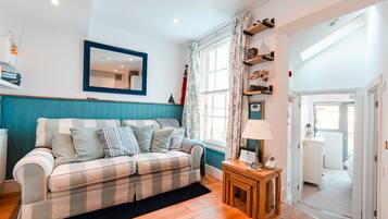 Apartment | Living area | 32-inch flat-screen TV with cable channels, TV, Netflix