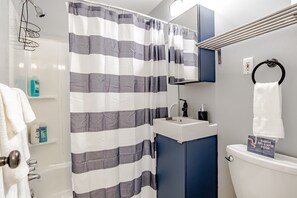 Bathtub, hair dryer, towels