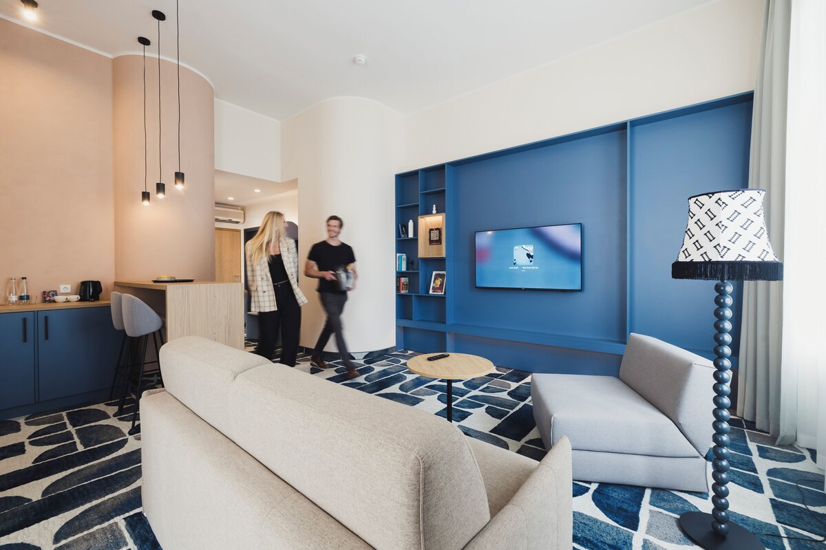 Standard Suite | Living area | 49-inch Smart TV with digital channels, TV