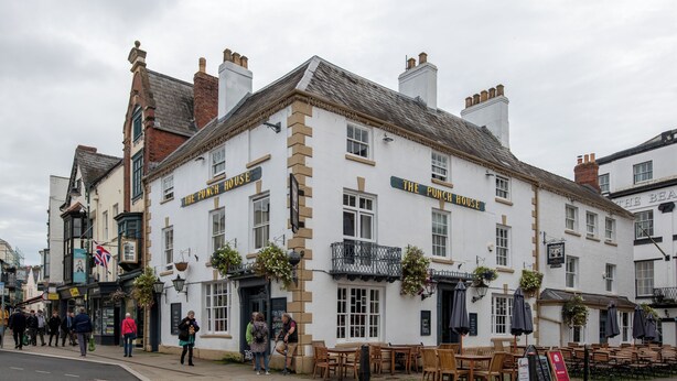 A traditional pub with outdoor seating and a sign reading "The Punch House". - Punch House (Monmouth)