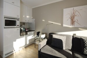 Apartamento superior, banheiro privativo | Cozinha compartilhada