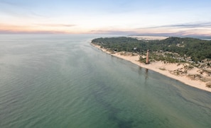 Enjoy a serene coastal escape with a picturesque beach and lush surroundings.