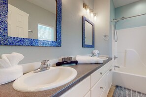Bathtub, hair dryer, towels