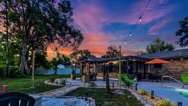 A backyard with a pool, a gazebo, and a patio area with outdoor seating. - SWEET HOME With Private Pool, Patio,& Huge backyard. (Orange Park)