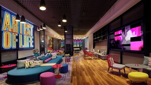 A modern lounge area with a neon sign reading "ART OF LIFE," comfortable seating, and a bar area. - Aloft Shijiazhuang (Shijiazhuang)