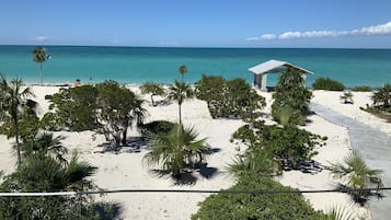On the beach, sun loungers, beach towels