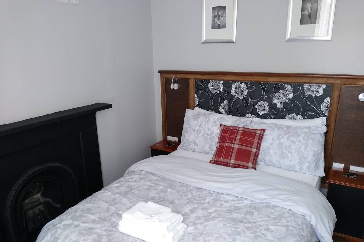 Blackout curtains, iron/ironing board, free WiFi, bed sheets