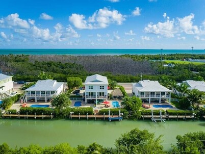 Canal Front with Dock, Private Pool, Huge Tiki Hut w/ TV, Bikes, Paddleboards!