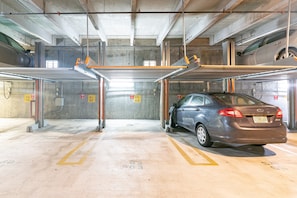 Park your vehicle in one of the designated parking bays, marked with numbered signs for easy identification.