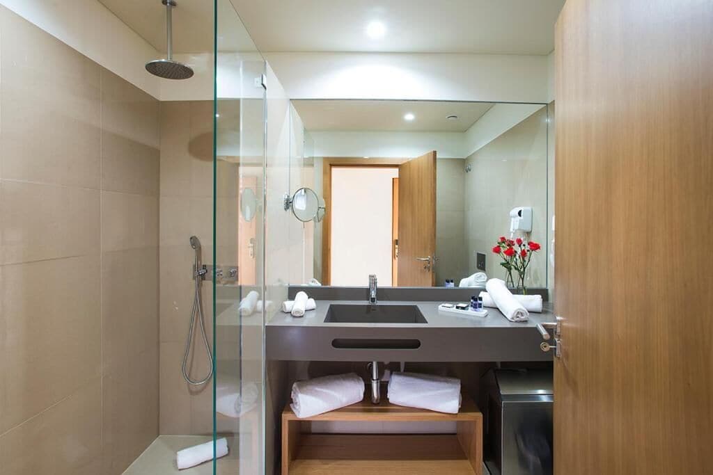 hair dryer, bathrobes, slippers, towels