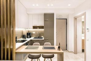 Comfort Apartment, 1 Queen Bed with Sofa bed | Living area | 45-inch Smart TV with digital channels, tablet