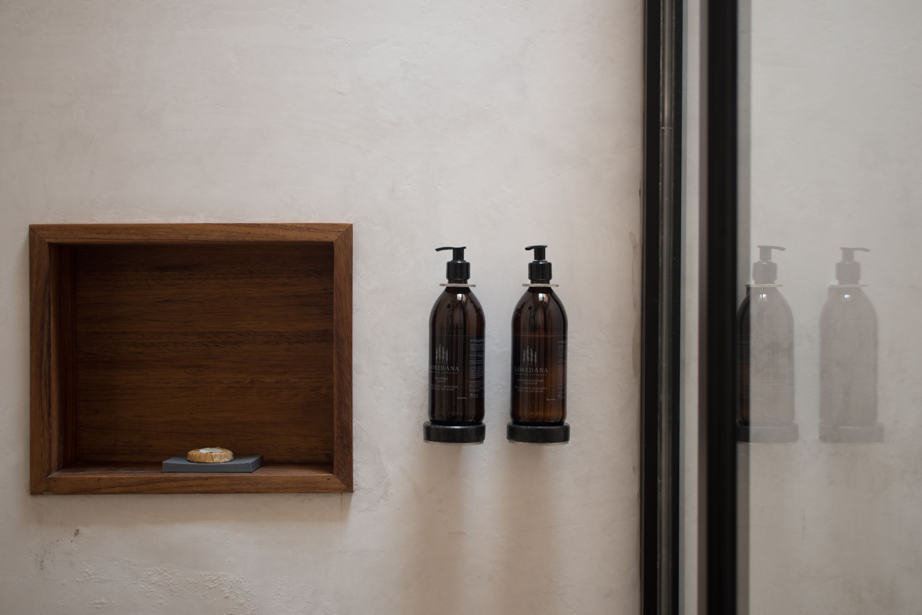 designer toiletries, hair dryer, towels, soap