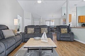 A modern living room with a sofa set, a coffee table, and a dining area in the background. - ☆☀︎❀ Tropical Paradise! Heated Pool, Boat Parking, Near Beaches! (Sebastian)