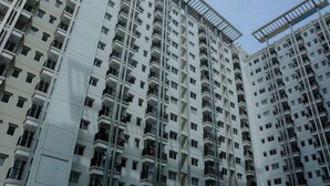 A high-rise residential building with multiple balconies and a modern architectural design. - Cozy and Modern Signature Park Grande Studio Apartment (Jakarta)