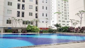 Outdoor pool - Simple and Cozy Living Studio Room at Bassura City Apartment (Jakarta)