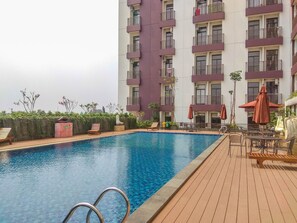 Outdoor pool - Comfortable and Cozy Living Studio Room at Dave Apartment (Depok)