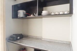Fridge, stovetop, cookware/dishes/utensils - Best Deal 2BR Apartment at Dian Regency near ITS (Surabaya)