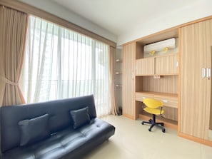 TV - Stylish & Comfy Studio at Dago Suites Apartment (Bandung)