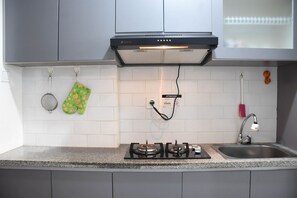 Fridge, stovetop, cookware/dishes/utensils - Nice and Comfy Studio Apartment at Signature Park Grande (Jakarta)