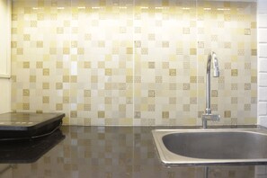 Private kitchen - Cozy High Floor 1BR at Parahyangan Residence (Bandung)