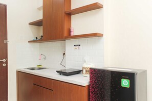 Private kitchen - Nice and Elegant Studio at Riverview Jababeka Apartment (Cikarang)
