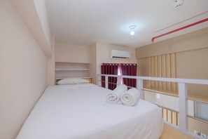 Room | 1 bedroom, bed sheets - Comfy and Tidy Studio at Dave Apartment (Depok)