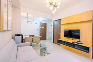 TV - Elegant and Comfy 3BR Transpark Cibubur Apartment (Depok)