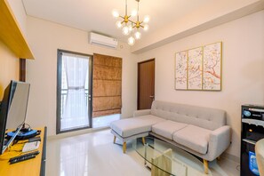TV - Elegant and Comfy 3BR Transpark Cibubur Apartment (Depok)