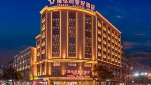 A multi-story hotel with illuminated signage reading "Vienna Classic Hotel". - Vienna Classic Hotel (Hengdian Film and Television City Dream Valley) (Dongyang)