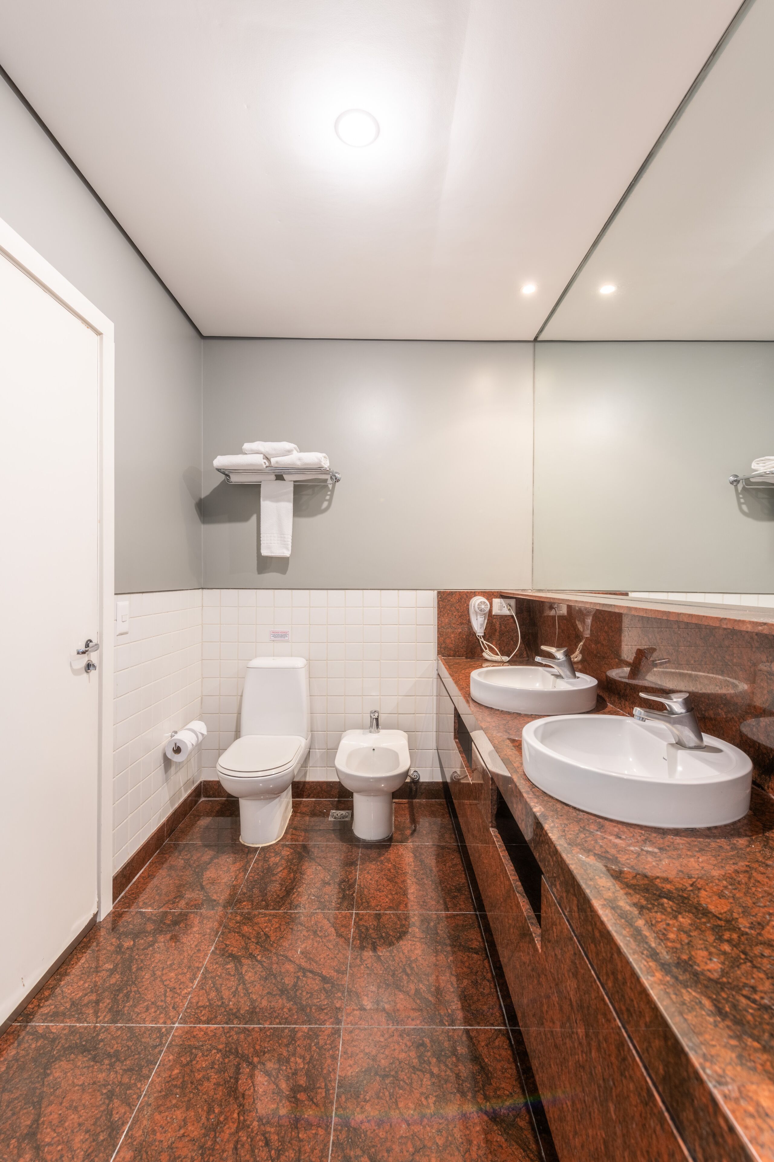 deluxe triple room | bathroom | shower, rainfall showerhead, hair dryer, towels