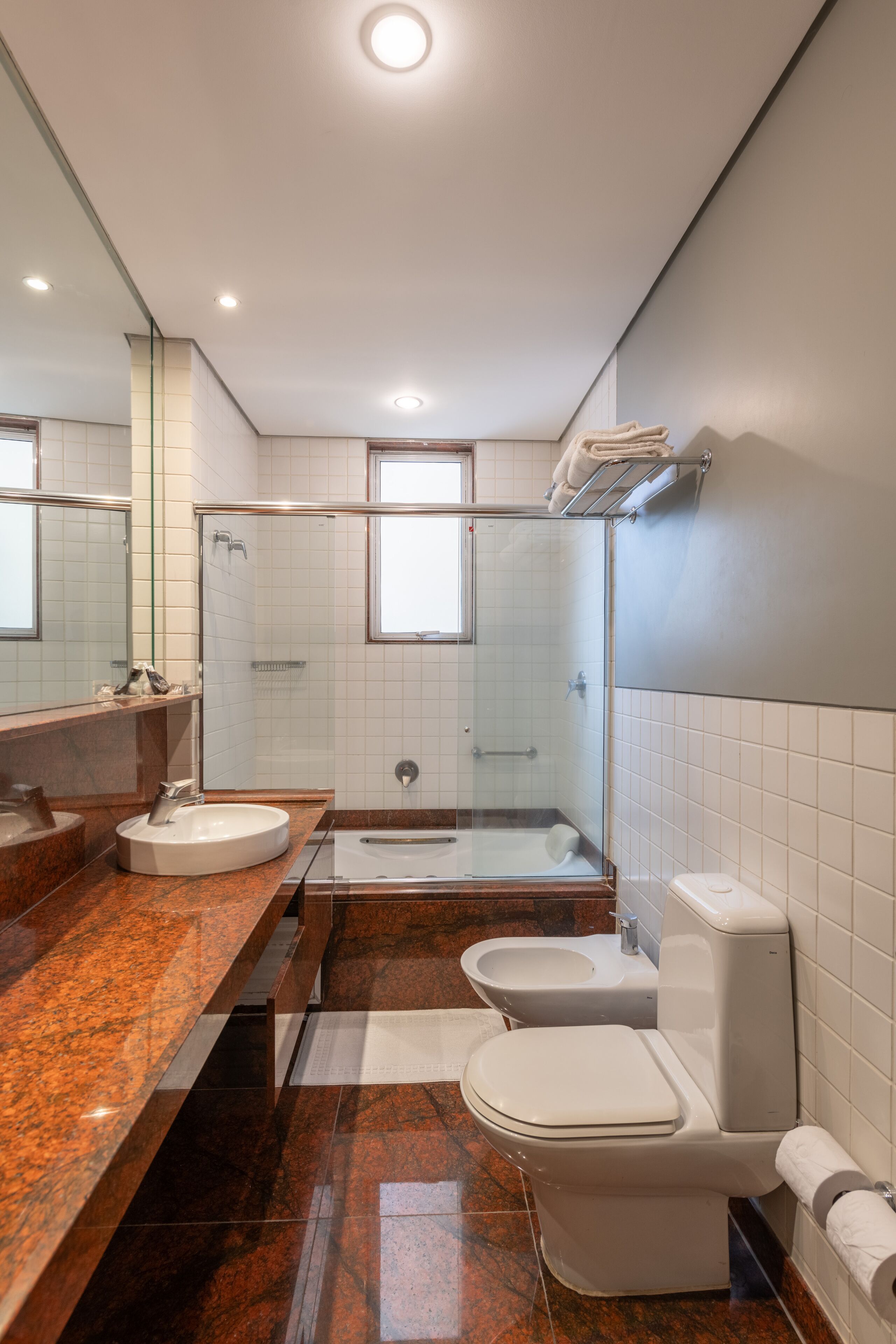 suite studio junior | bathroom | shower, rainfall showerhead, hair dryer, towels