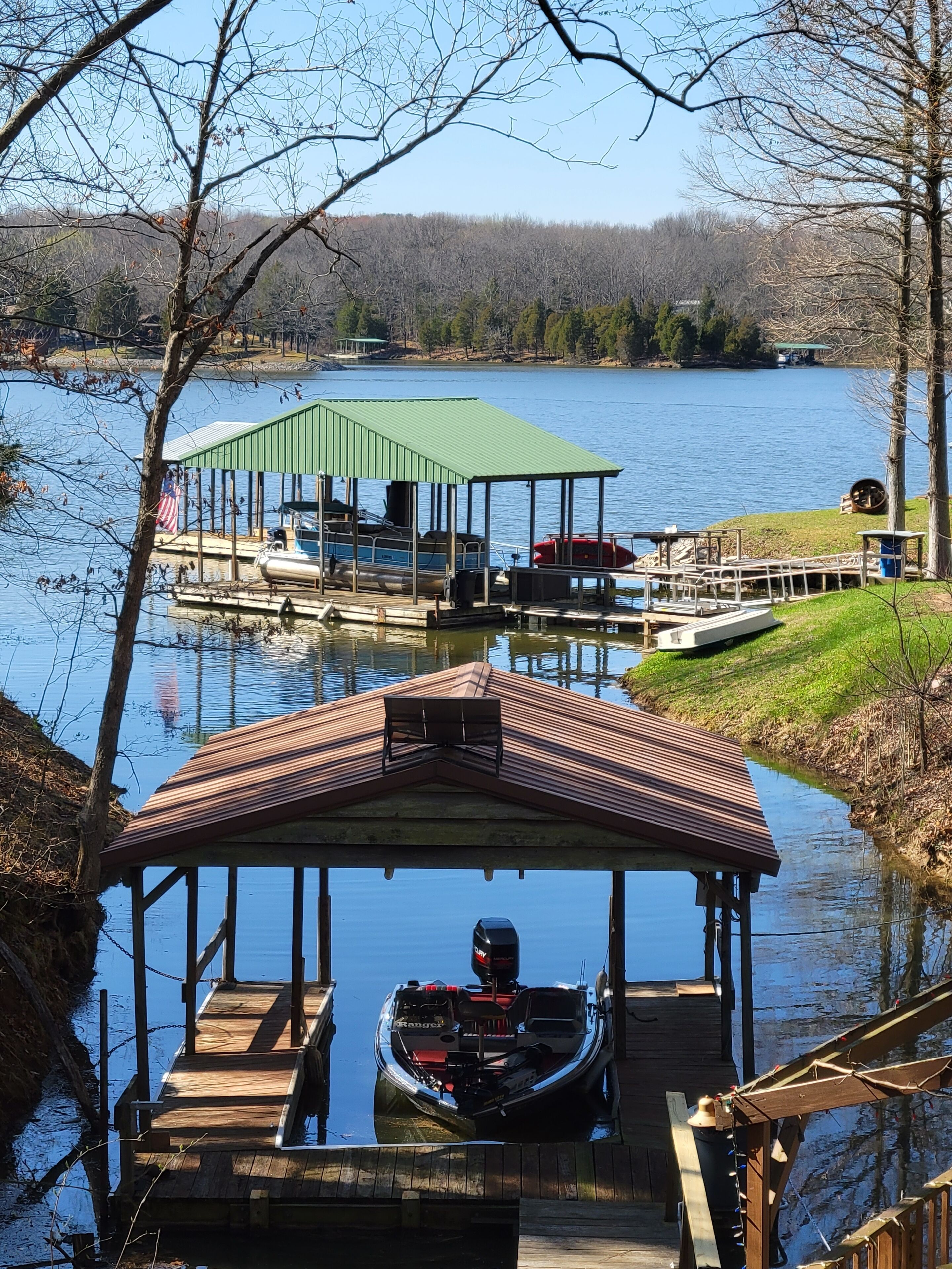Lake Front. Large shaded deck with Covered Dock access. Fire pit.