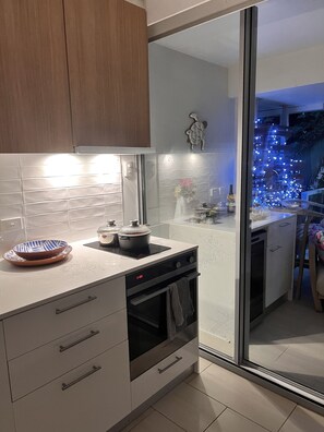 Enjoy a convenient kitchen with an oven and dishwasher, plus a balcony with a view.