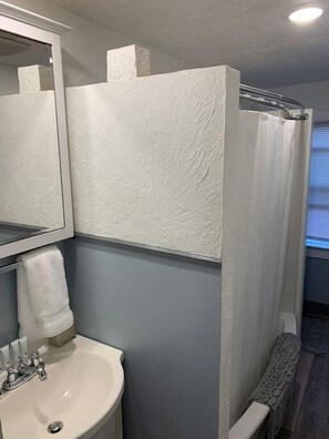 Bathtub, hair dryer, towels